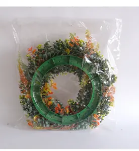 Back view of artificial eucalyptus wreath with green plastic frame in plastic bag.