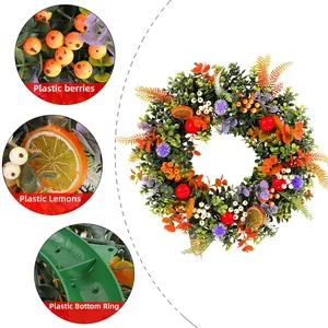 Summer eucalyptus wreath with artificial berries and lemon slices for door decoration
