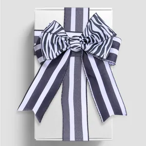 Black and white striped ribbon bow for elegant gift box decoration and DIY crafts