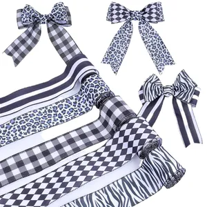 Assorted black and white patterned decorative ribbons for DIY gift wrapping and creative crafts