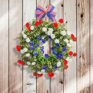 Patriotic Independence Day front door wreath with red white blue flowers and flag bow