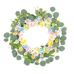 Couronne printanière décorative avec marguerites, roses et eucalyptus pour porte