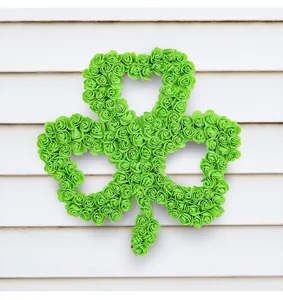 Vibrant green artificial rose shamrock wreath for St. Patrick's Day outdoor door decor.