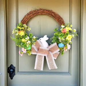 Easter bunny wreath with colorful foam eggs and burlap bow for spring door decoration