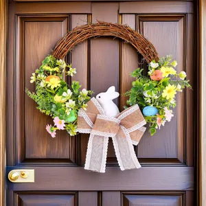 Vibrant Easter wreath featuring white bunny, colorful eggs, and burlap bow on door.