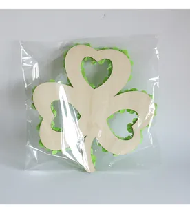 Packaged St. Patrick's Day wooden shamrock wreath with green petal decorations