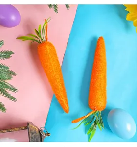 Vista detallada de zanahorias decorativas naranjas grandes y pequeñas para Pascua