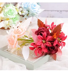 Detailed view of artificial rose and lily bouquet with realistic water droplets
