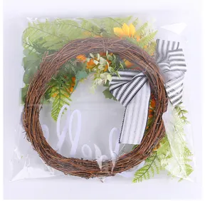 Close-up of a sunflower wreath in clear plastic packaging for protection and storage
