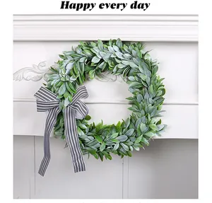 Detail of artificial lamb's ear wreath with a classic black and white striped bow