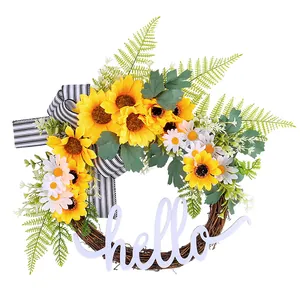 Vibrant sunflower wreath with "hello" sign and striped ribbon for door decoration