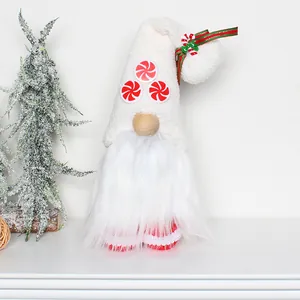 Detailed close-up of a plush Christmas gnome featuring candy cane hat decorations and white beard