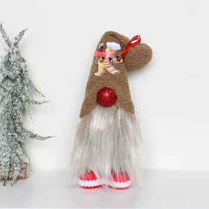 Close-up of a Christmas gnome with a brown hat and a chef gingerbread man detail.