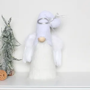 Detailed view of a plush white faceless angel gnome with silver ribbon decoration