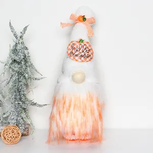 Detail of autumn gnome plush doll with hello pumpkin embroidery and orange beard