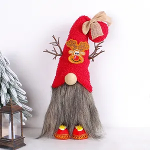 Close-up detail of a festive Christmas gnome featuring reindeer antlers and red hat