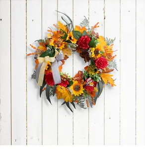 Detail view of Thanksgiving harvest wreath with maple leaves and sunflowers decoration