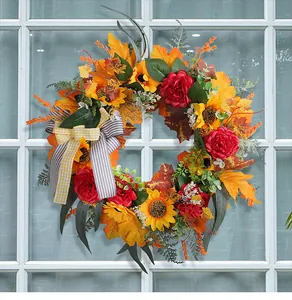 Detailed view of Thanksgiving wreath featuring sunflowers, red peonies, and gingham bow