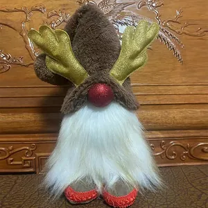 Detailed view of a plush Christmas faceless gnome featuring gold antlers and white beard