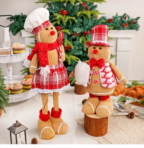 Schattige kerst peperkoek man koppel poppen met koksmuts en hoge hoed decoratie