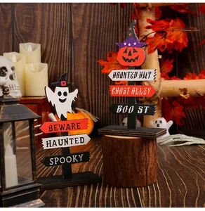 Halloween wooden sign decorations featuring ghost and pumpkin designs in a festive setting