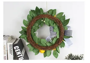 Artificial lemon wreath with striped bow decoration for home and garden door hanging.