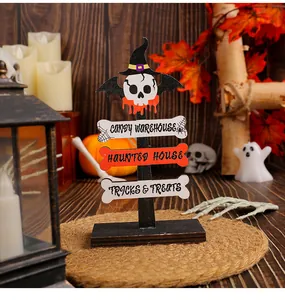 Detailed view of Halloween wooden road sign featuring skulls and spooky text engravings