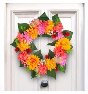 Detailed view of colorful autumn chrysanthemum wreath for Thanksgiving door decor.
