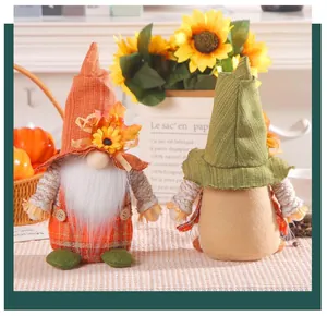 Close-up view showing the front and back details of Thanksgiving sunflower gnome dolls