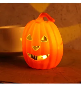 Atmospheric glowing orange Halloween pumpkin lantern decoration set on a rustic wooden table