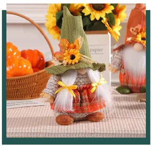 Handmade Thanksgiving gnome doll with sunflower and autumn leaf decor for festive desktop display
