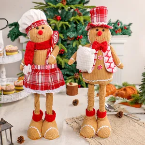 Paar feestelijke peperkoekmannetjes knuffels met uitschuifbare benen voor kerst