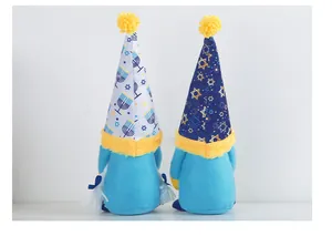 Detail of Hanukkah gnomes with Star of David and Menorah patterns on blue hats