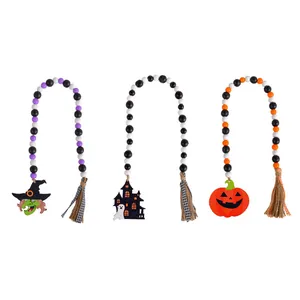 Set of three Halloween wooden bead garlands featuring witch, haunted house, and pumpkin charms