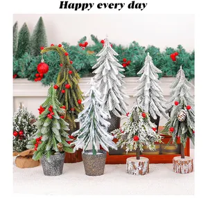 Assorted mini Christmas trees with red berries and pinecones on rustic wood bases.