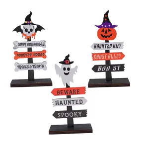 Set of three Halloween wooden signpost ornaments with skull, ghost, and pumpkin designs