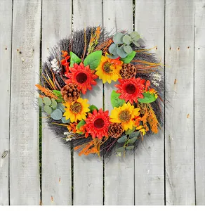 Detailed view of autumn sunflower wreath with pinecones on rustic wood background