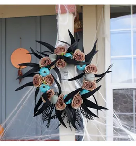 Halloween wreath with black leaves, roses, blue pumpkins and skulls for door decor