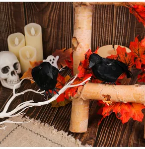 Two realistic black feathered crows perched on birch logs for festive Halloween decorations.