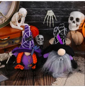 Close-up of Halloween faceless gnomes with vampire fangs and witch hats for party decor