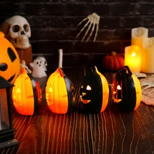 Four glowing Halloween pumpkin lanterns with warm LED lights for festive indoor party decor