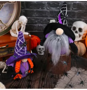 Pair of handcrafted Halloween vampire gnome figurines with spider and pumpkin prop decor