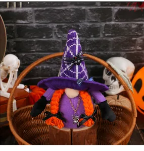Detailed view of a purple Halloween gnome doll with orange braids and spider decorations