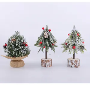 Three types of snowy mini desktop Christmas trees with red berries and pine cones
