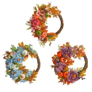 Decorative set of three autumn harvest wreaths with peonies, pumpkins and maple leaves