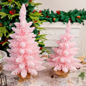 Elegante coppia di mini alberi di Natale rosa floccati con effetto neve su basi di iuta