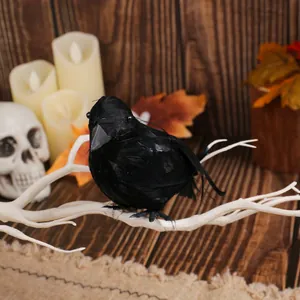 Realistic black feathered crow decoration for Halloween table decor and photography props
