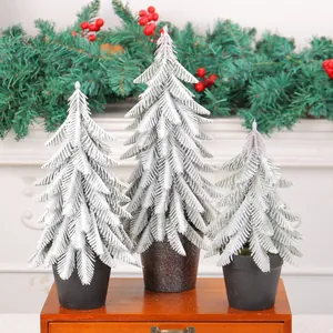 Set of 3 snow-dusted mini Christmas trees for festive desktop decoration and party props.