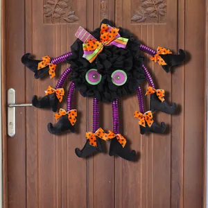 Halloween spider door wreath with witch boots and orange polka dot bows decoration