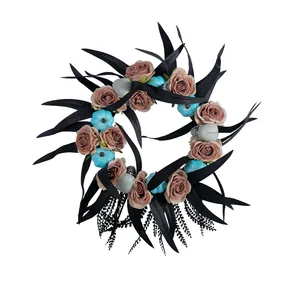 Gothic Halloween wreath with black leaves, roses, blue pumpkins and skulls